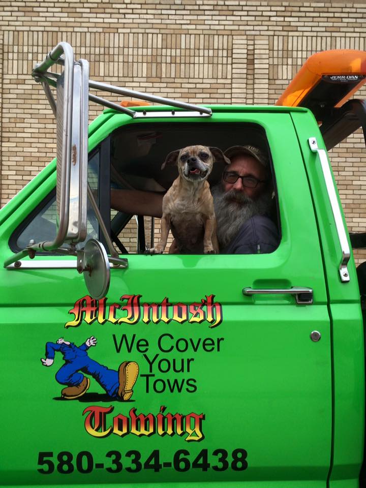 McIntosh Towing driver with his dog in the truck